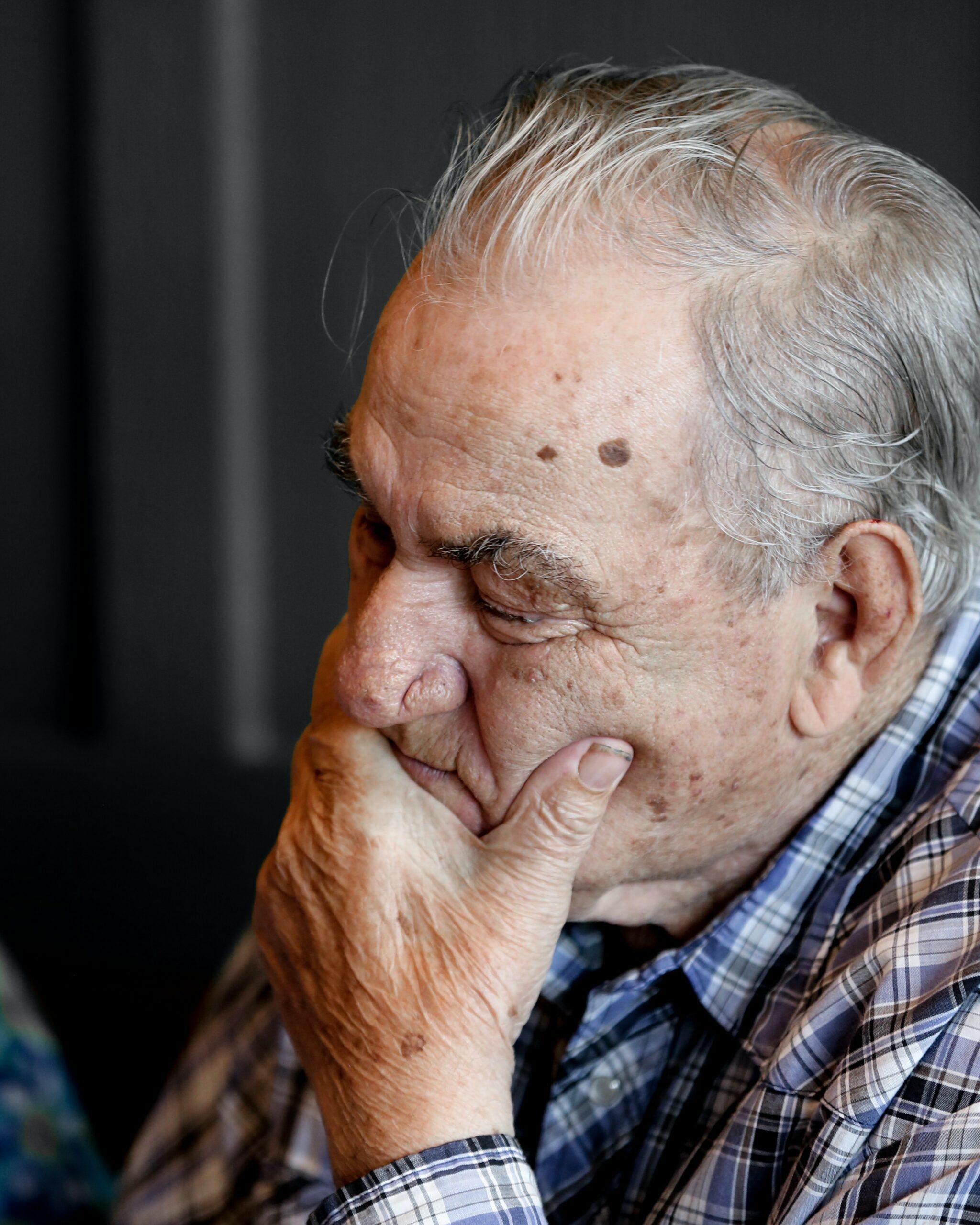 Elderly man looking worried