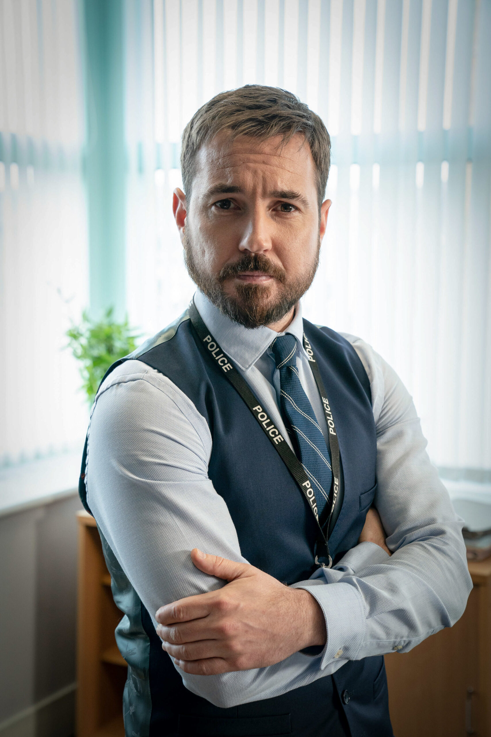 Martin Compston crossing his arms in Line of Duty