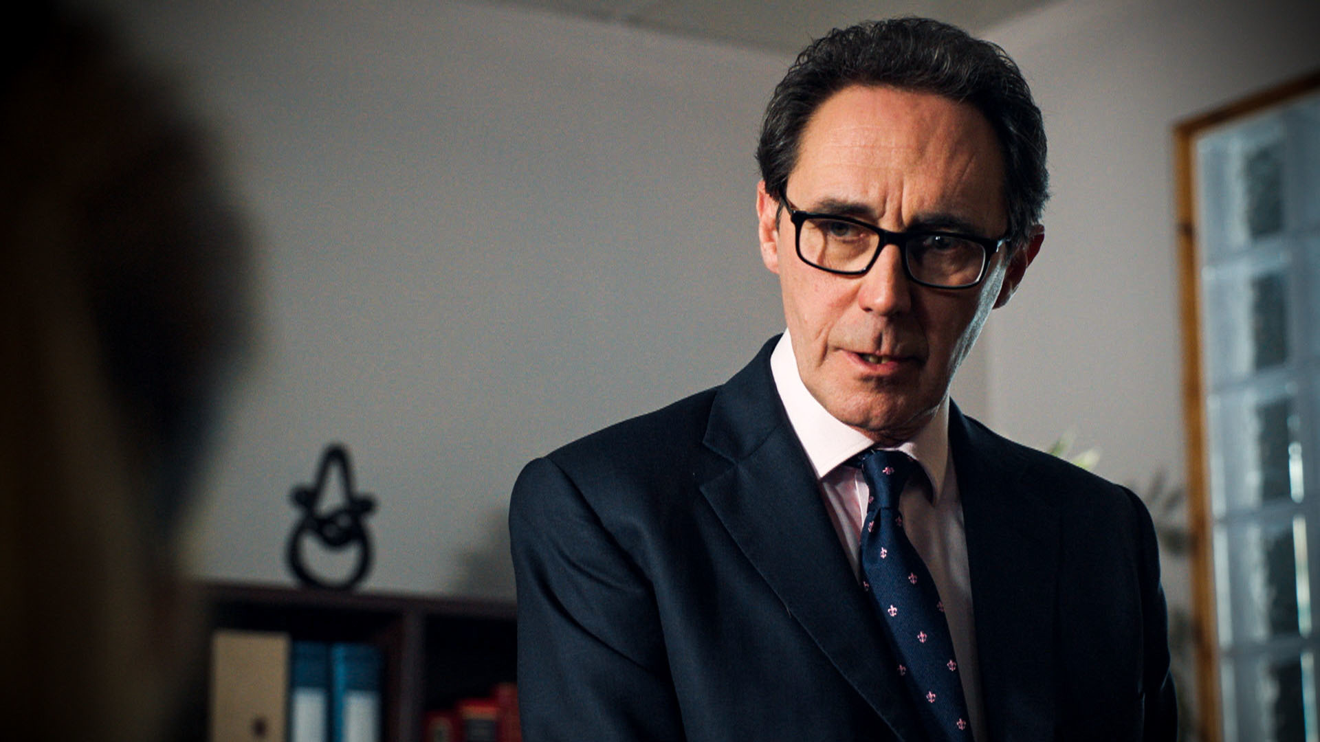 Holby City character looking concerned