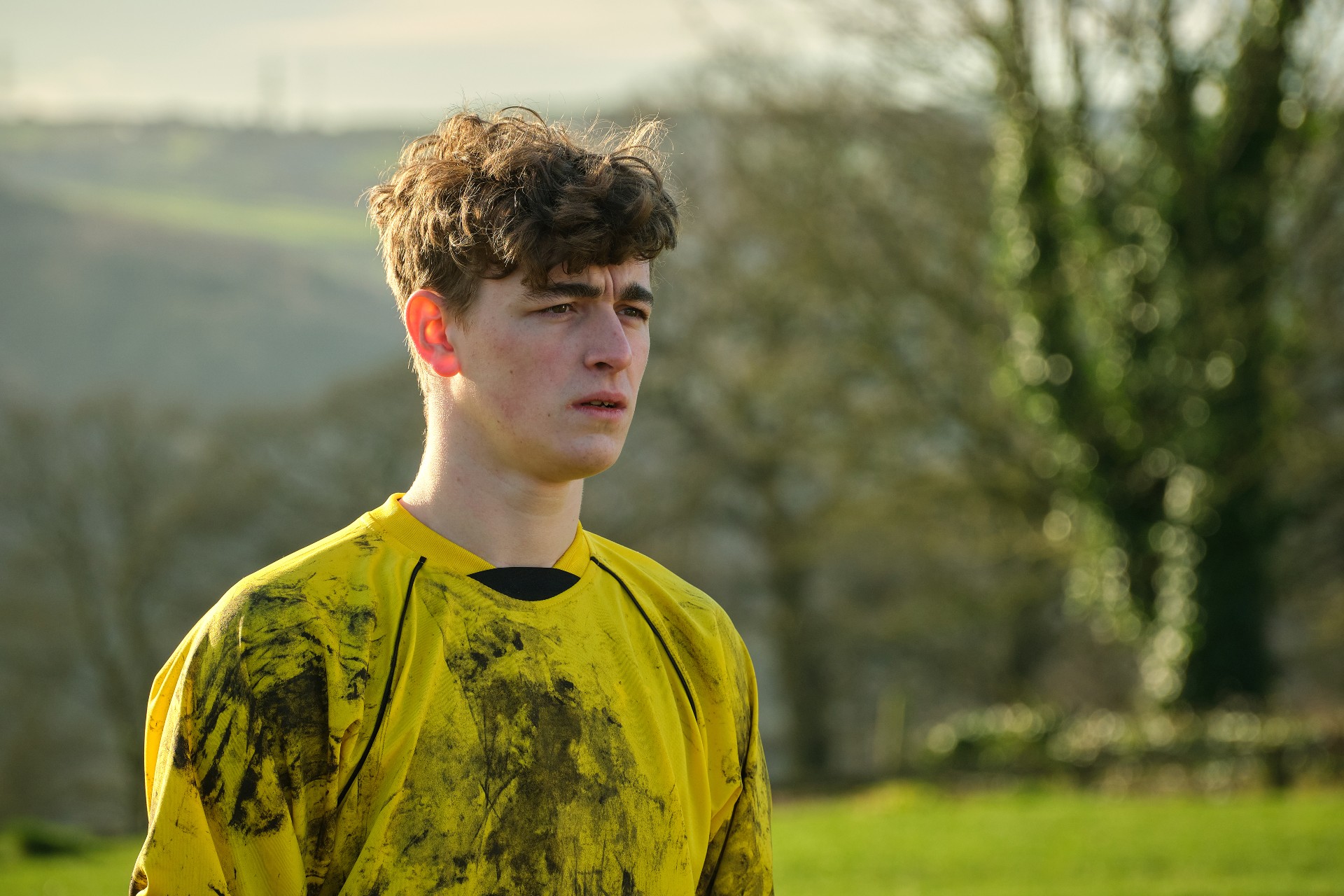 Rhys Connah wearing a muddy football kit in Happy Valley