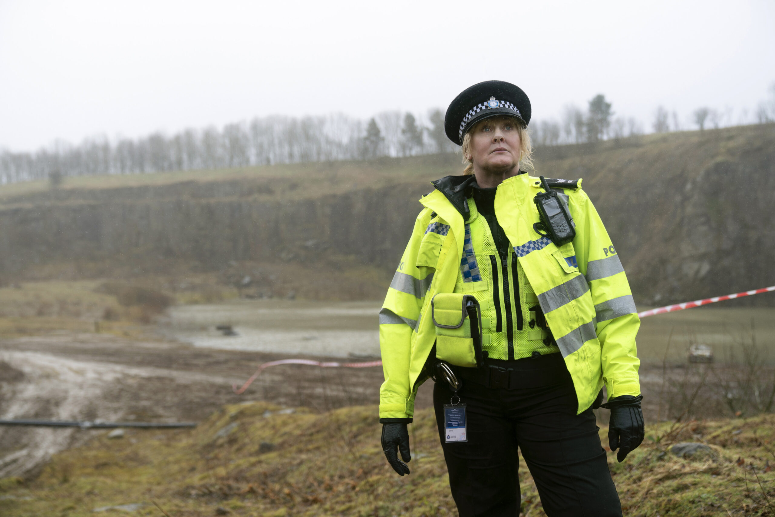 Sarah Lancashire standing in a field in Happy Valley