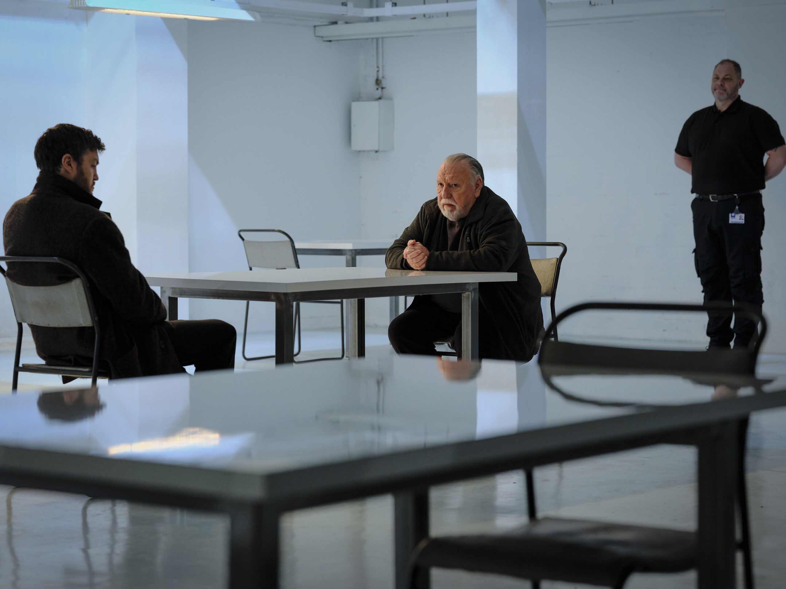 Dennis Creed sits with Cormoran in Strike Troubled Blood episode 3