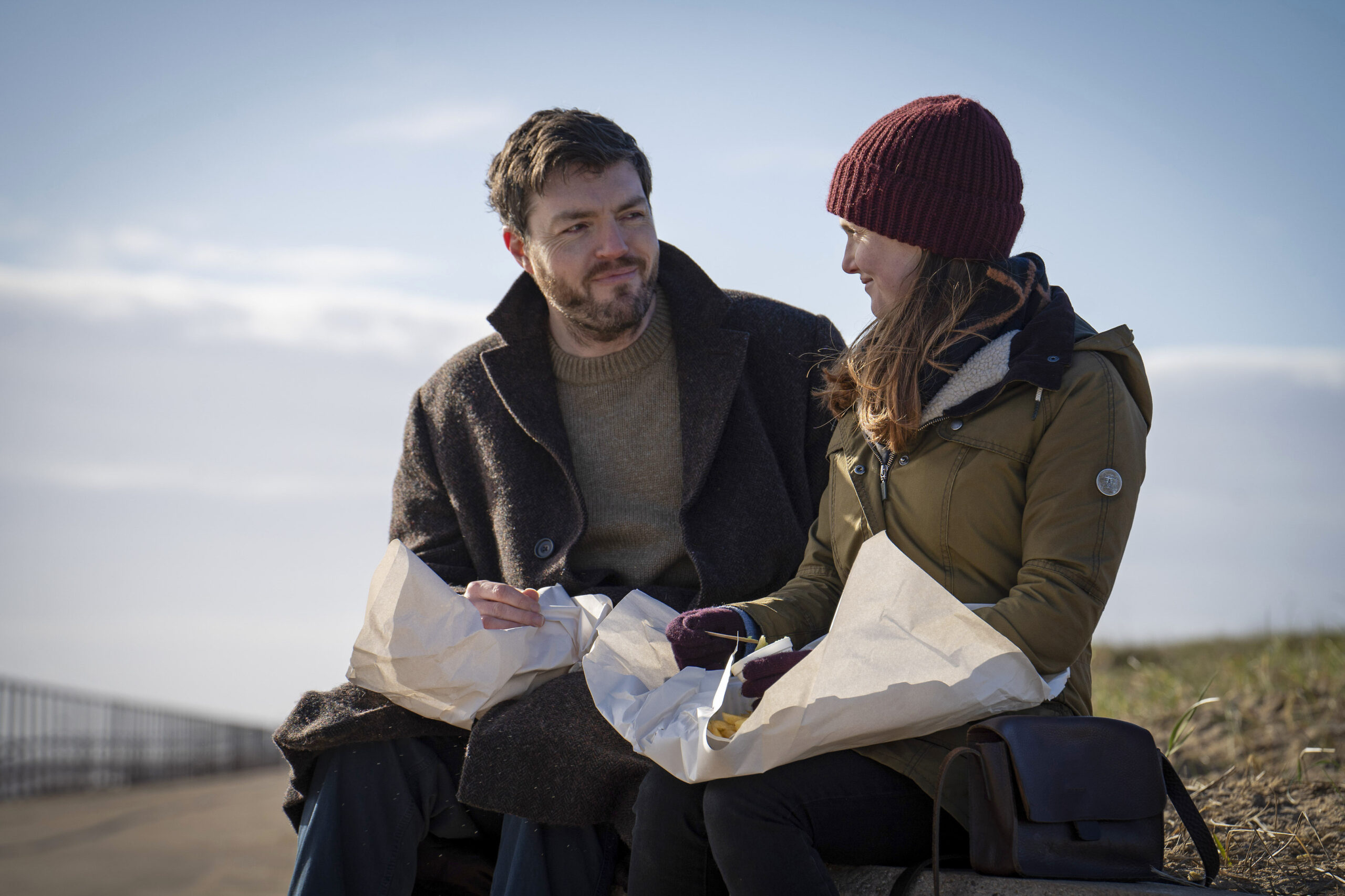Cormoran and Robin eat chips in Strike finale