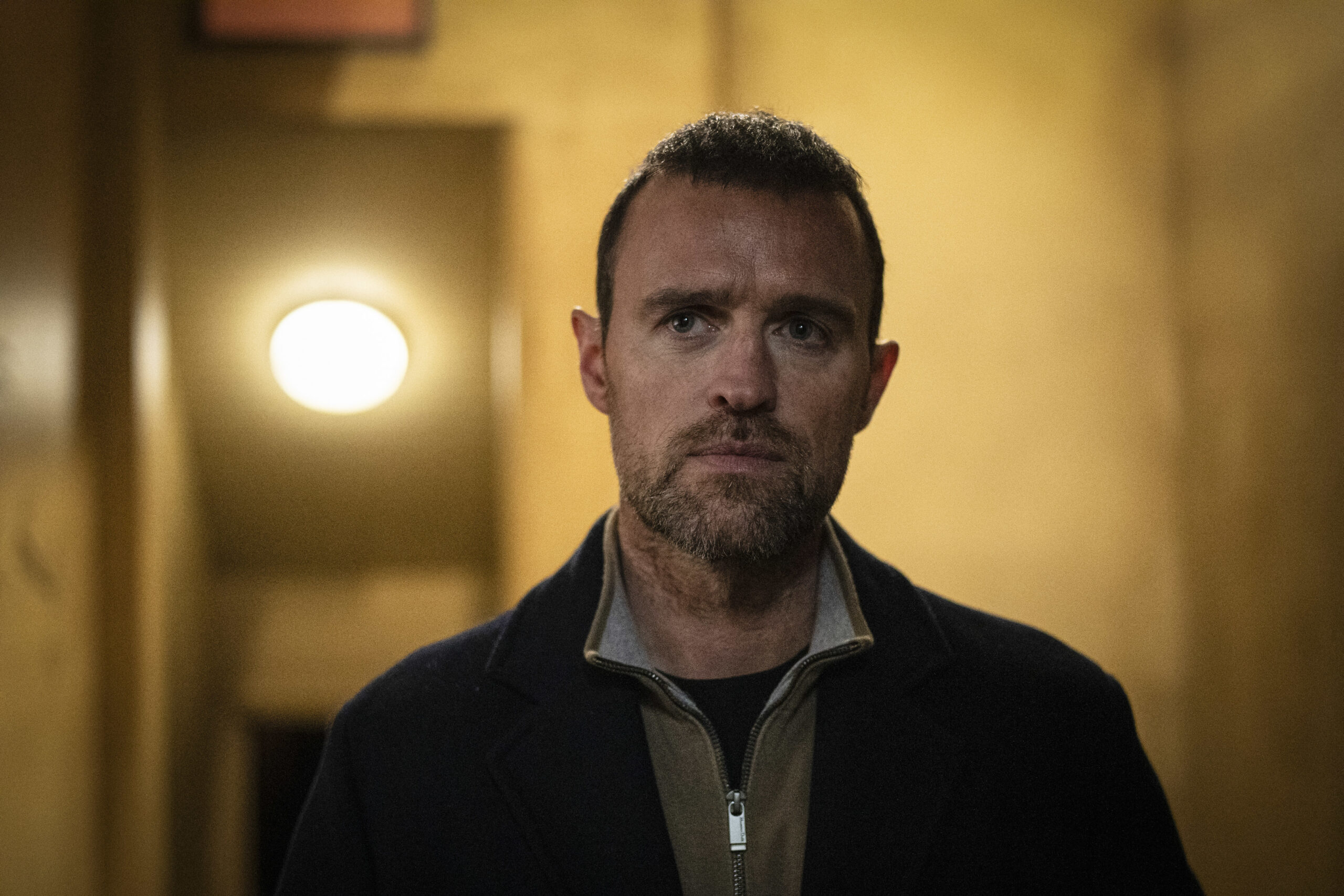 Saul Morris frowns in Strike Troubled Blood