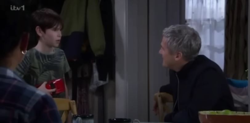 Caleb talks to Kyle while ,Moira looks on in Emmerdale