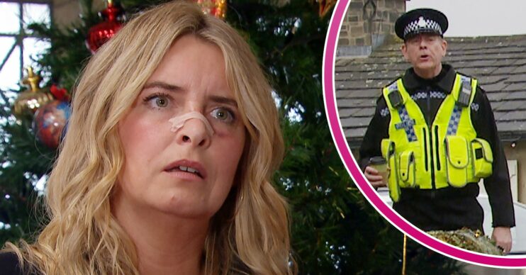 Charity looking annoyed and PC Swirling looking shocked in Emmerdale