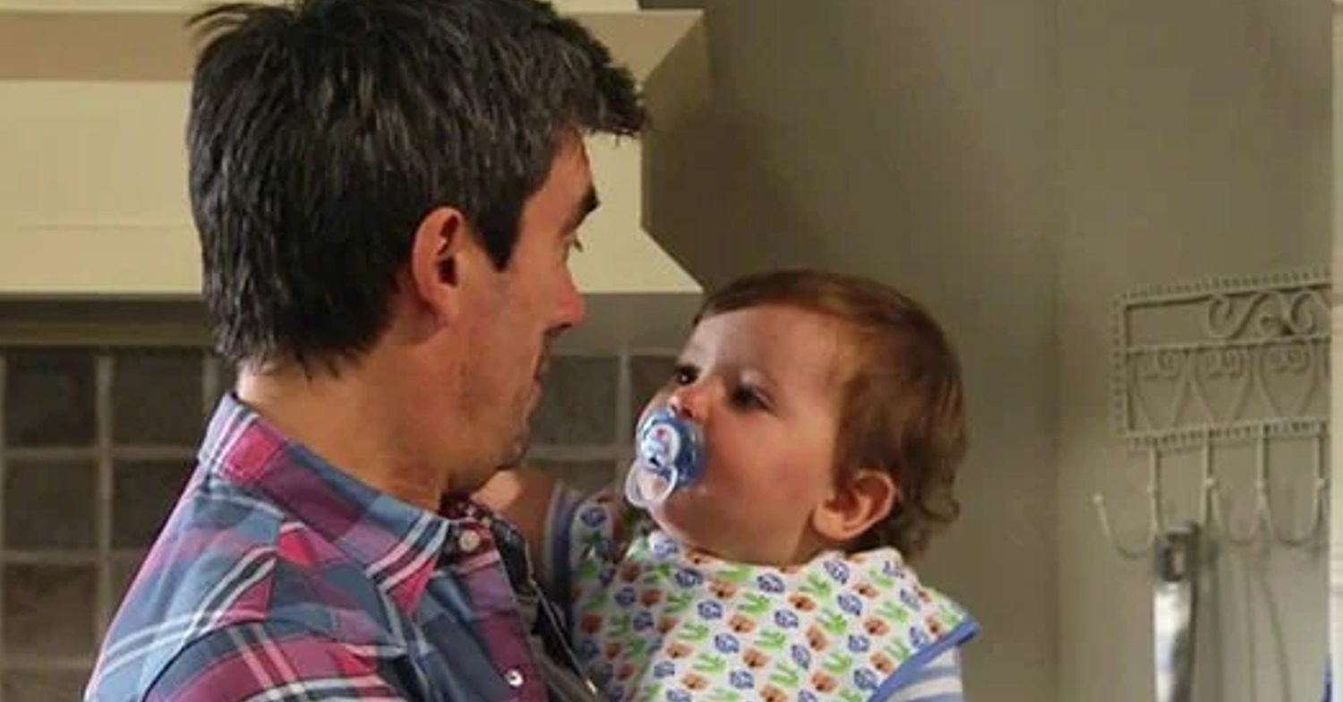 Cain and Isaac look at each other in Emmerdale