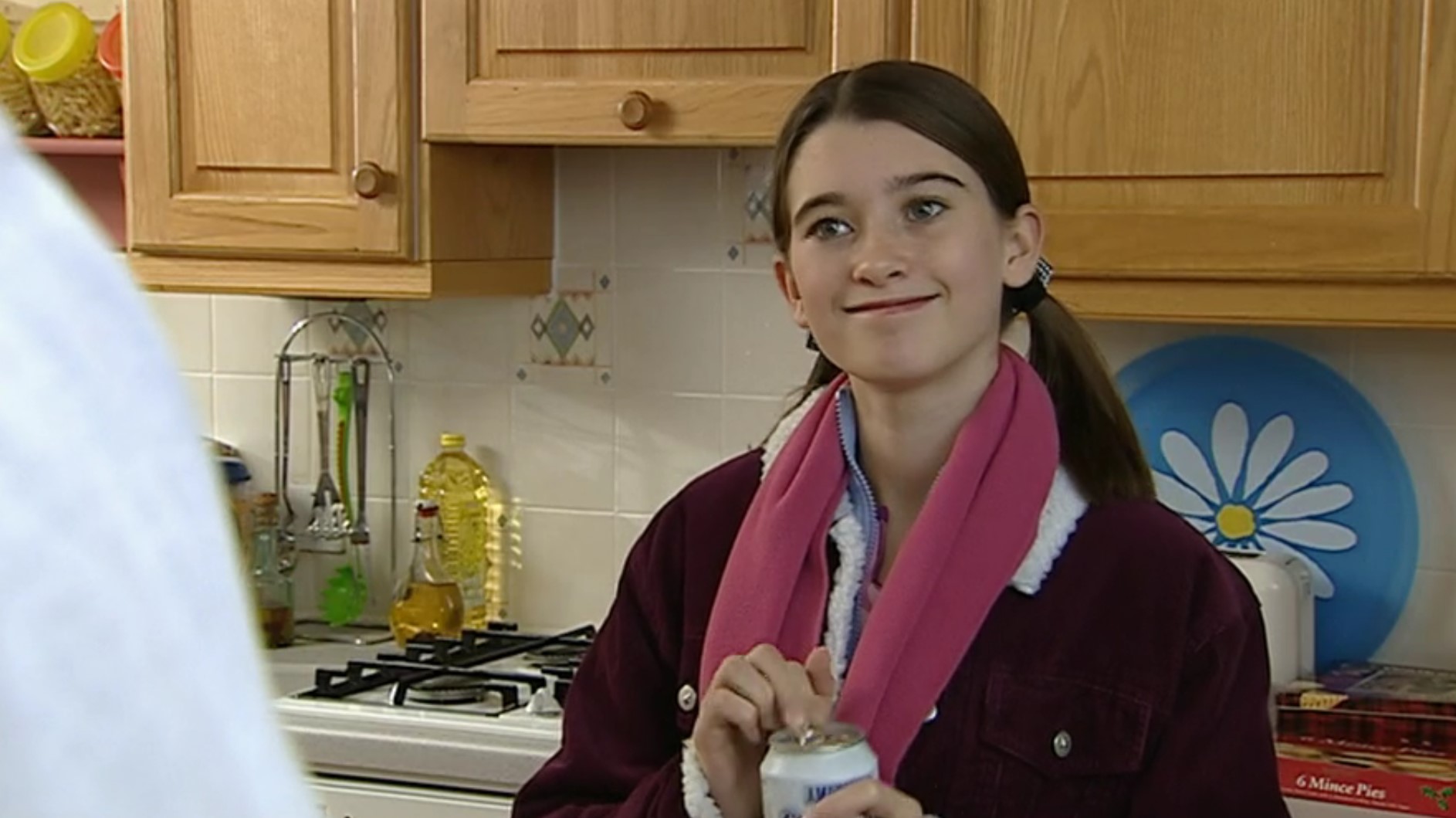 Debbie Dingle smiles as she opens a can of drink in Emmerdale