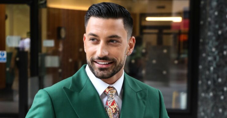 Strictly star Giovanni Pernice smiling in green suit