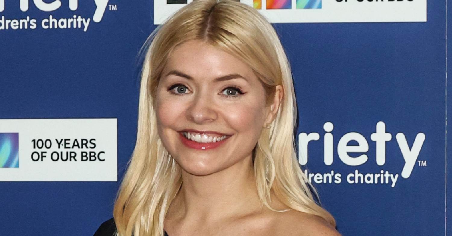 Holly Willoughby means on the red carpet with her blonde hair down