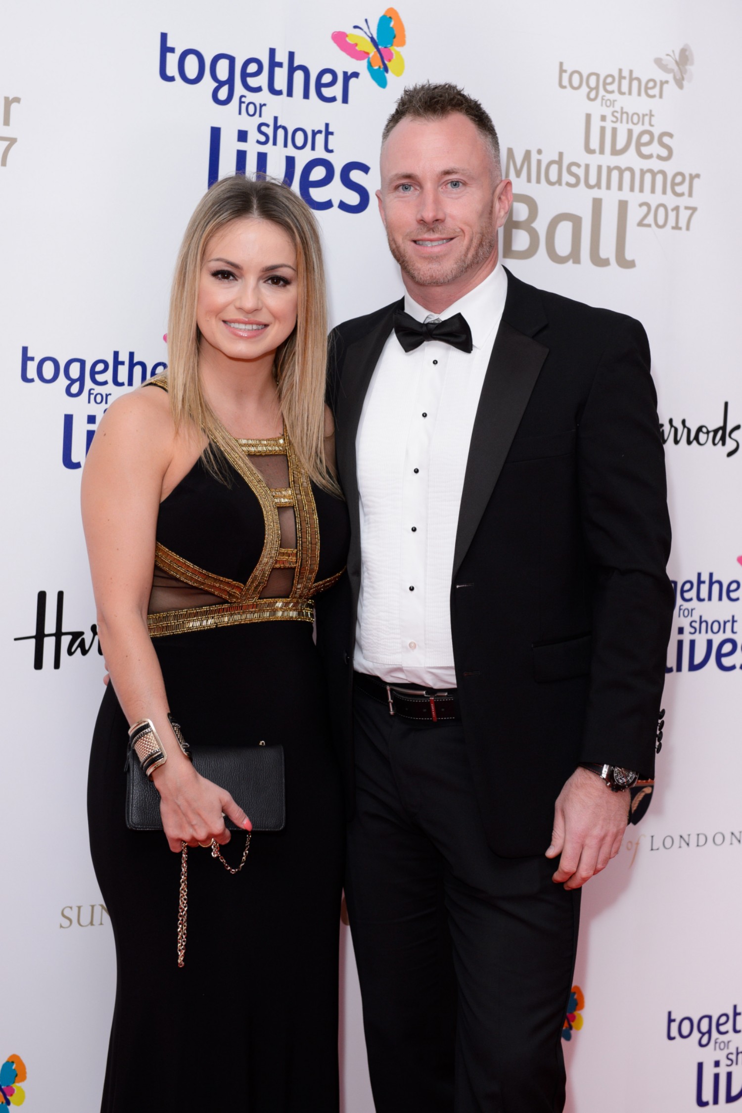 James and Ola Jordan posing together on the red carpet