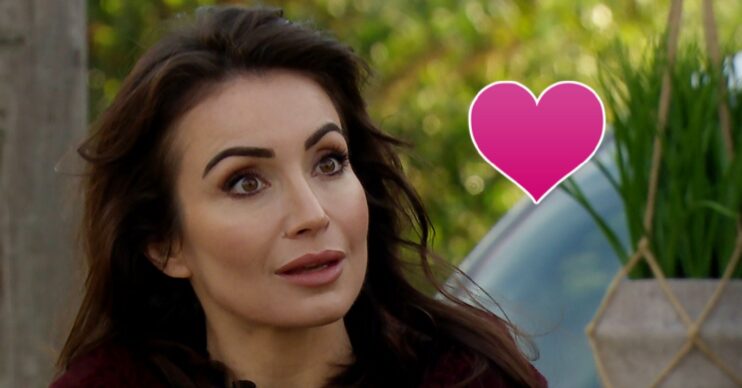Leyla looking shocked with a pink heart in Emmerdale