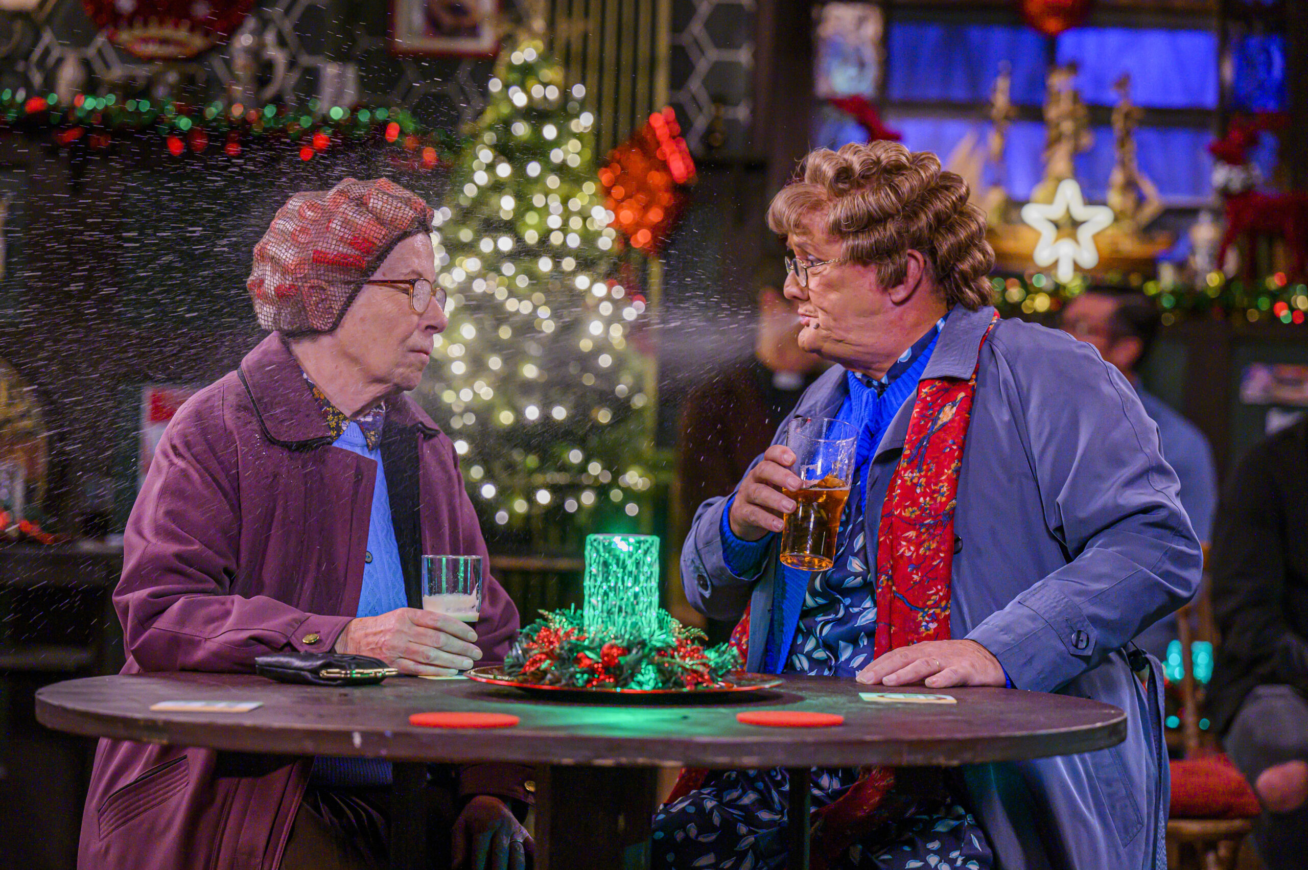 Mrs Brown's Boys star Brendan O'Carroll in character spitting out a drink