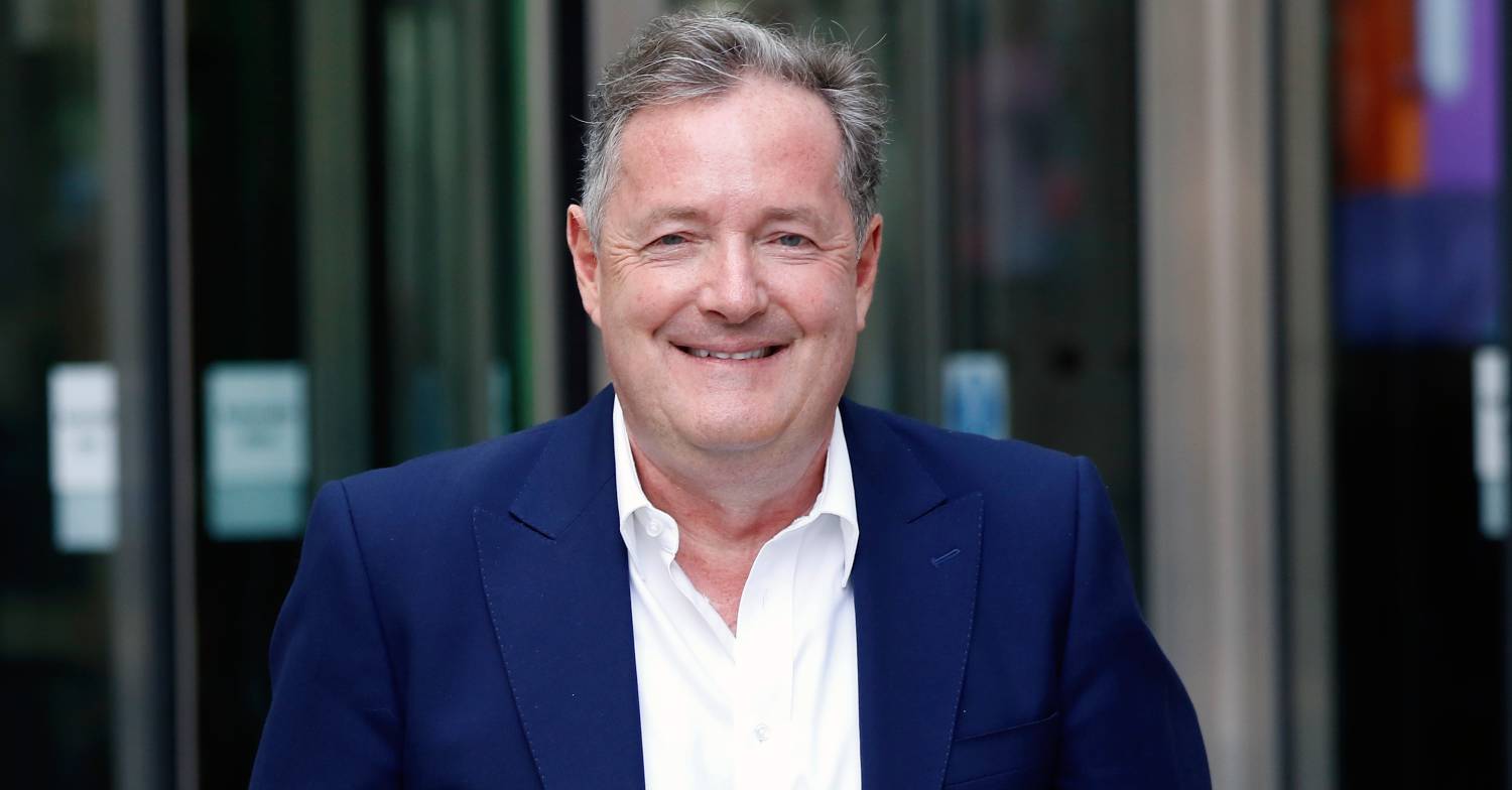Piers Morgan grins