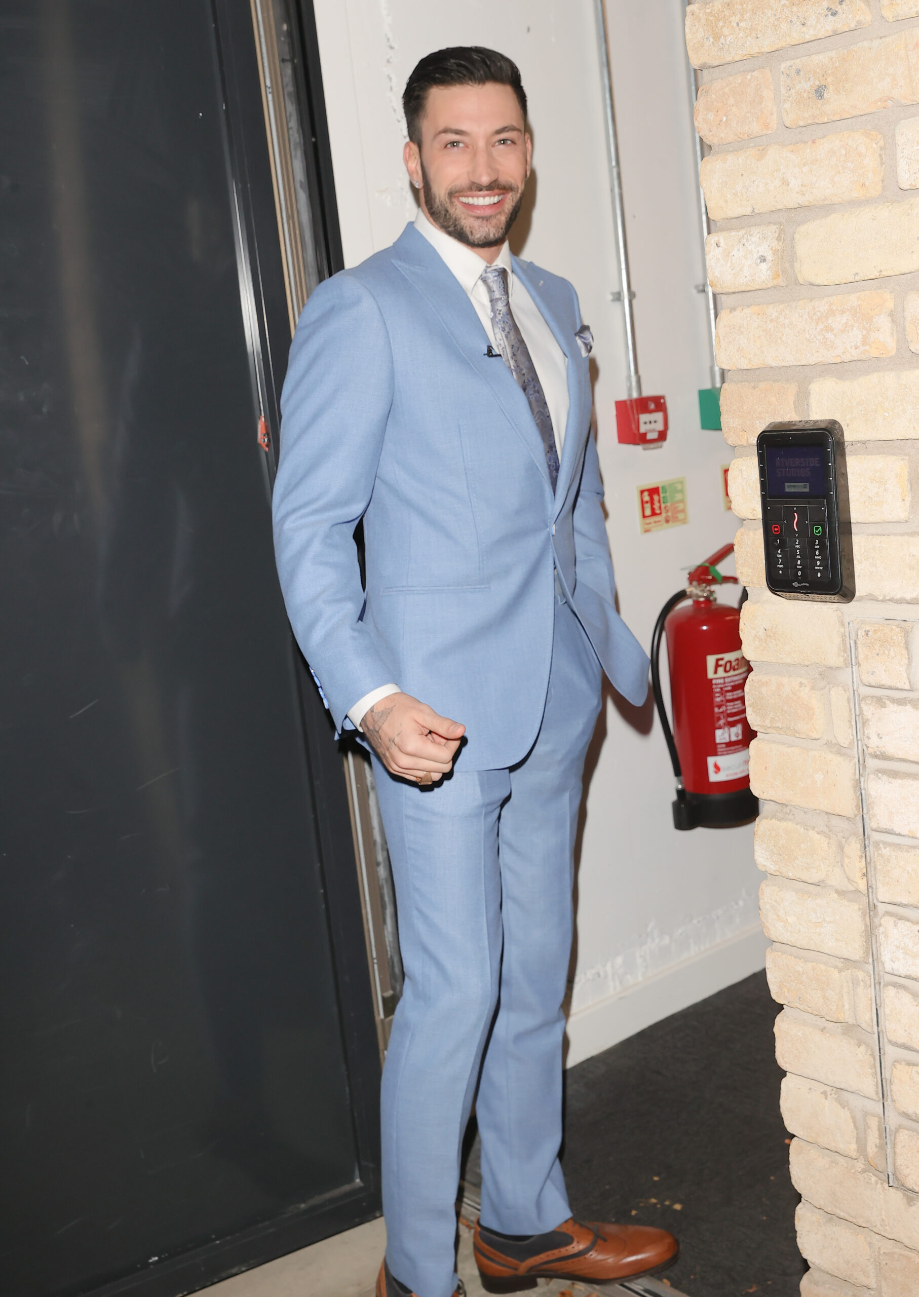 Strictly Come Dancing Giovanni Pernice wearing a blue suit and smiling