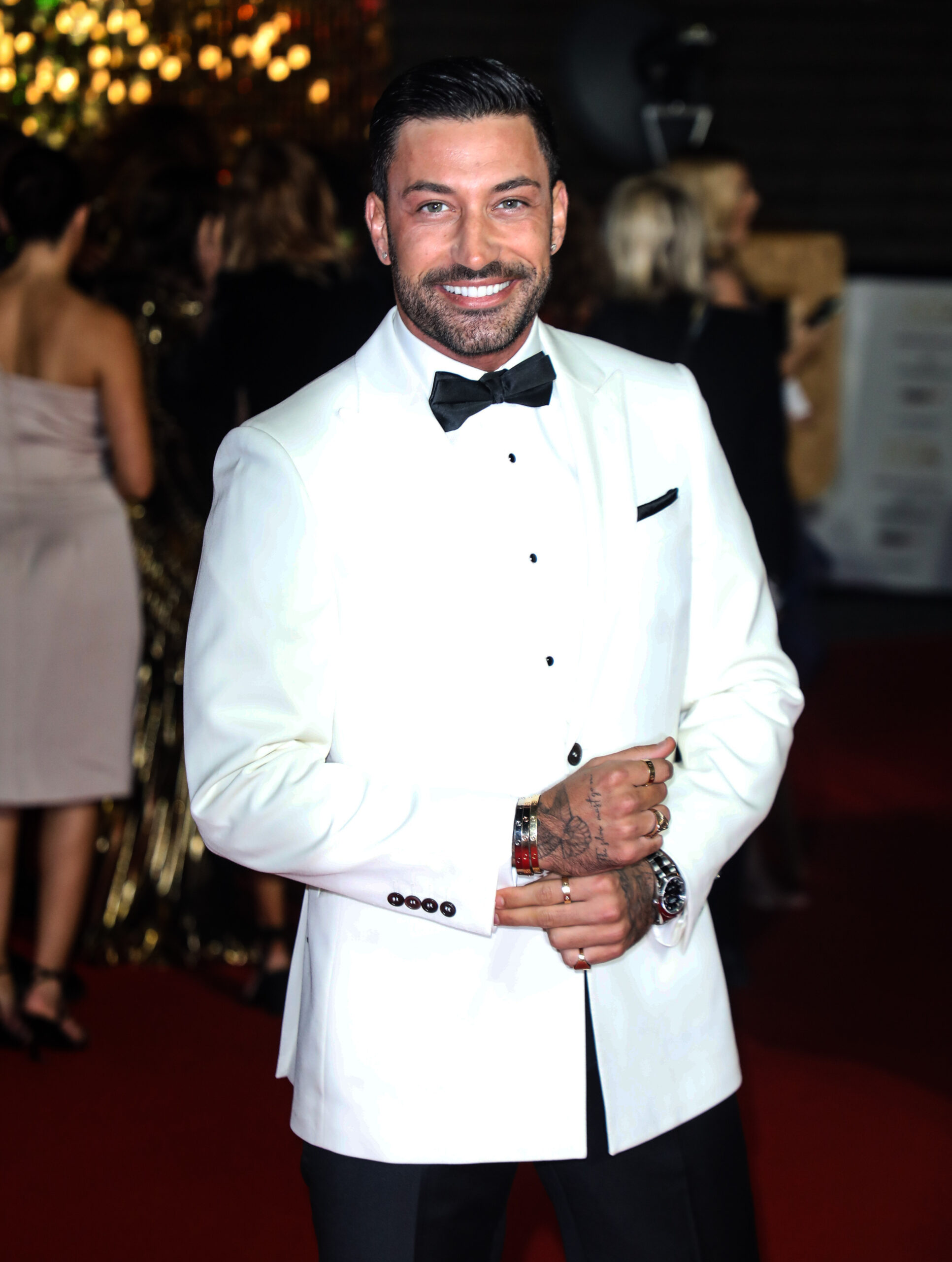 Strictly star Giovanni Pernice in a white jacket