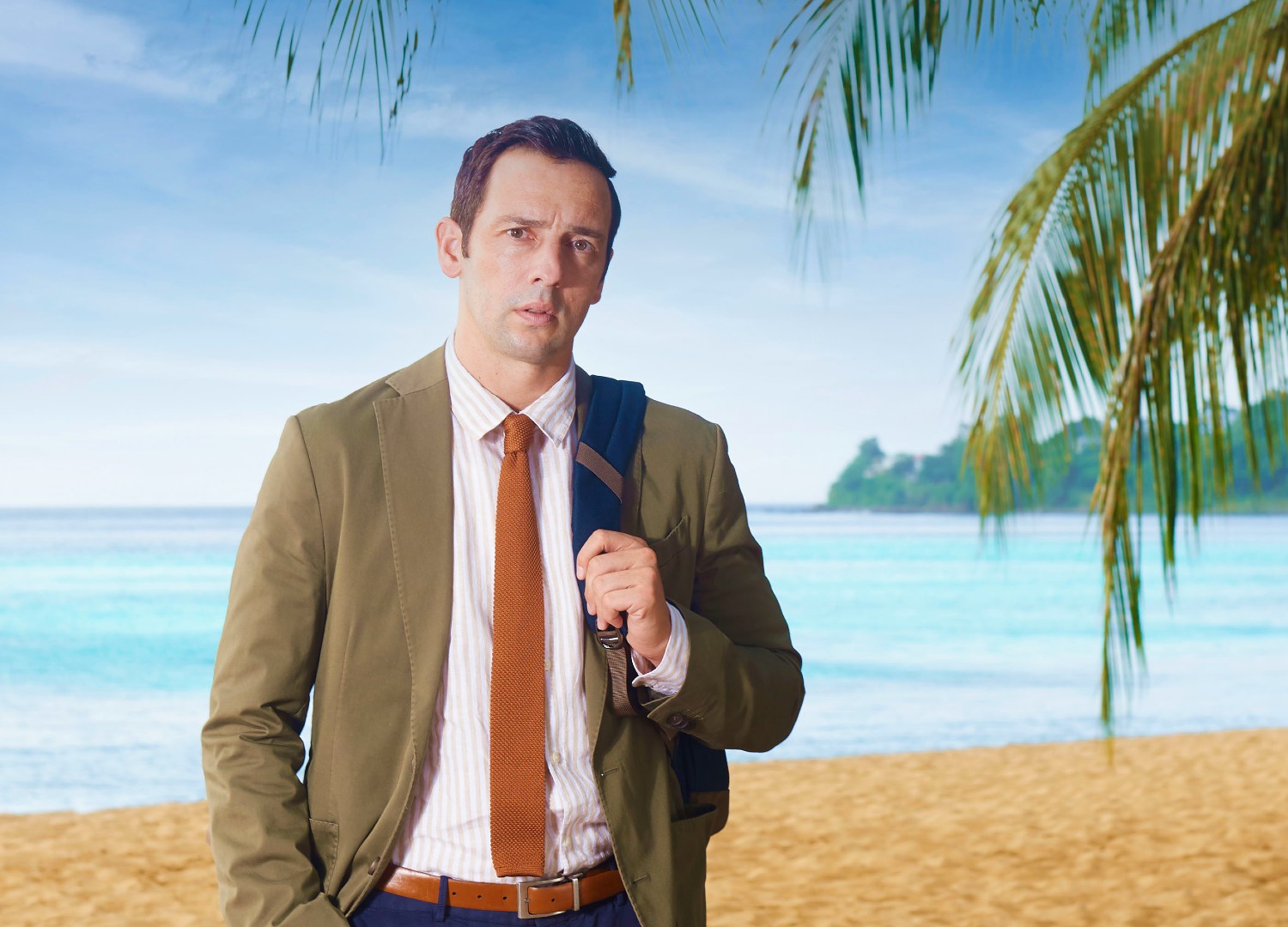 Ralf Little in character in Death In Paradise