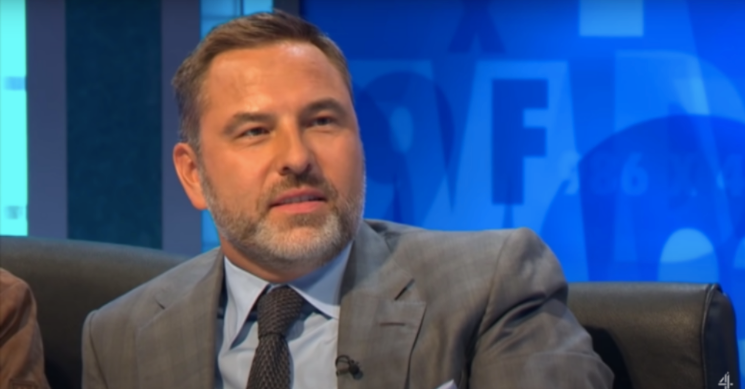 David Walliams half smiles