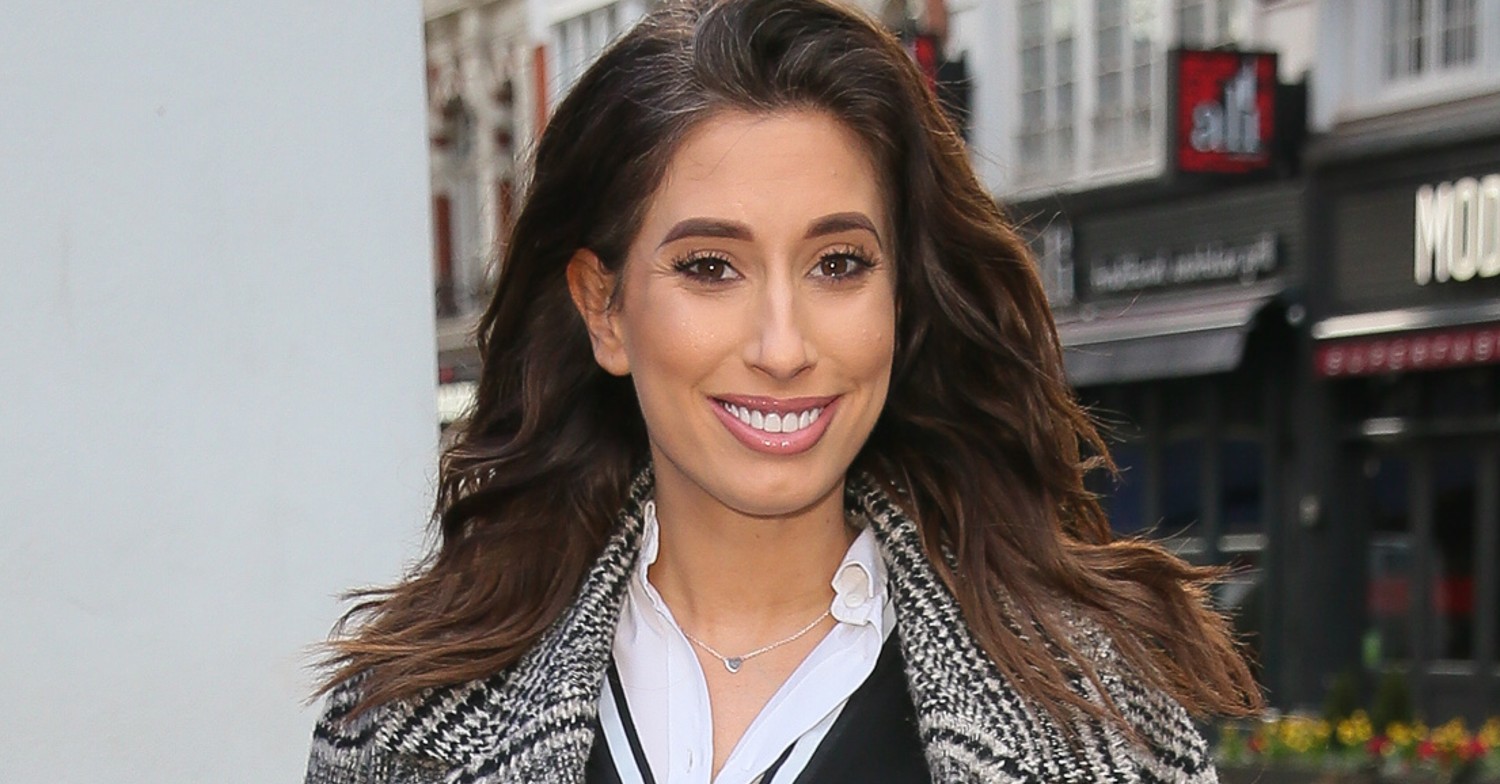 Stacey Solomon smiling walking down the street