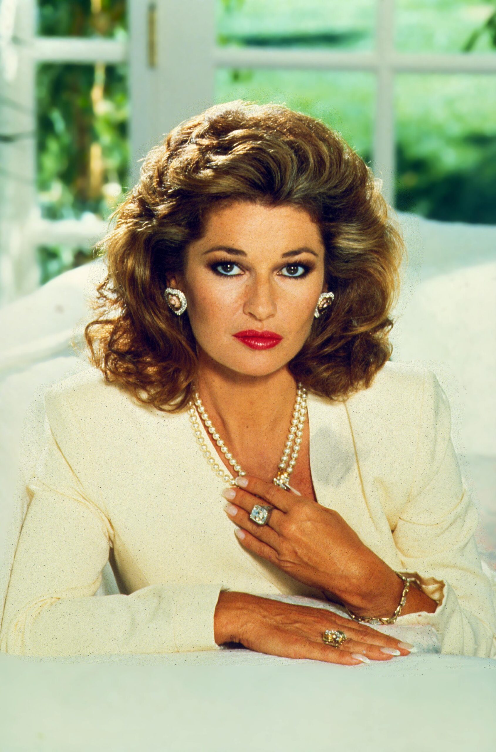 Sable Colby poses in white in Dynasty