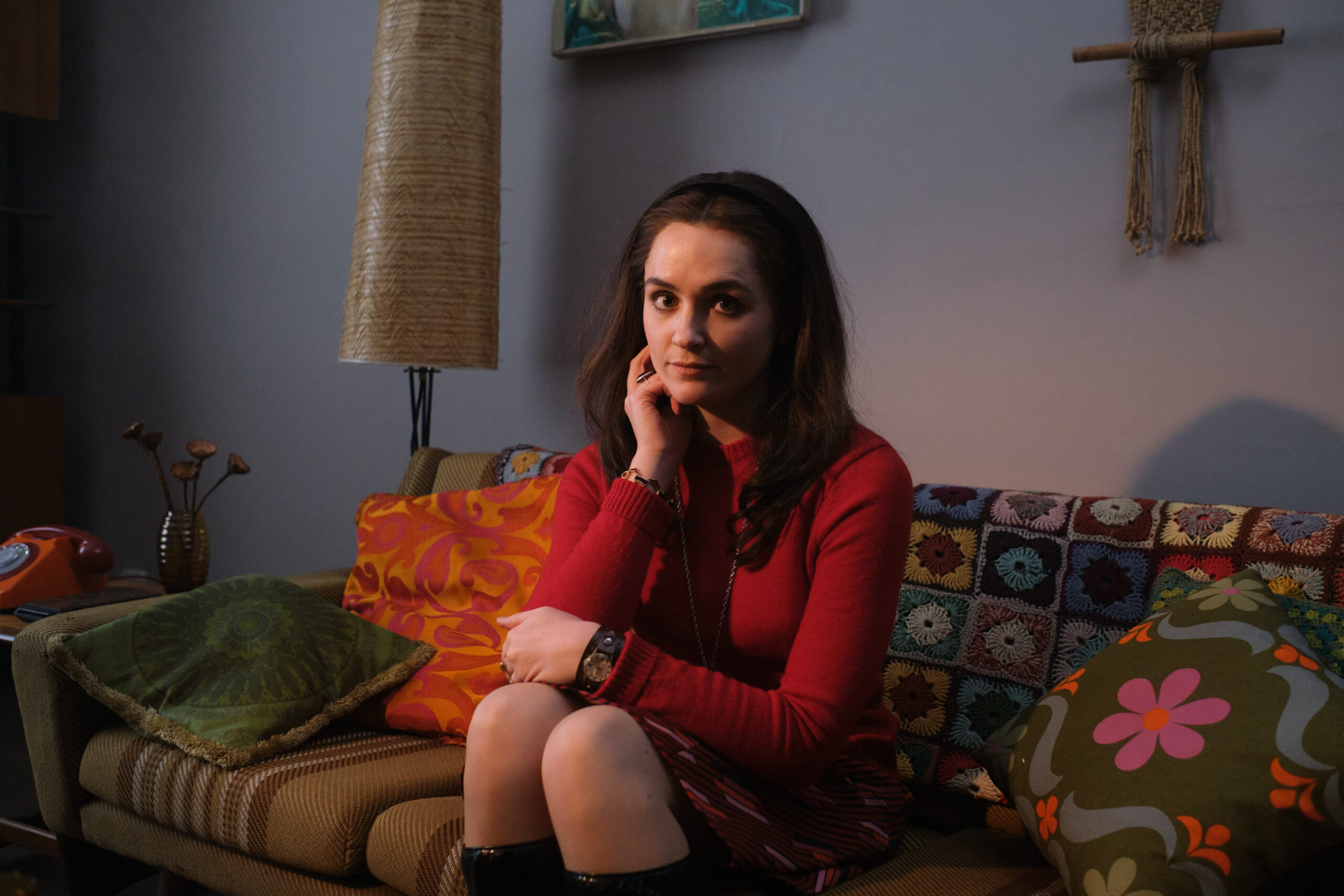 Shelia Buckley sits on a sofa in Stonehouse
