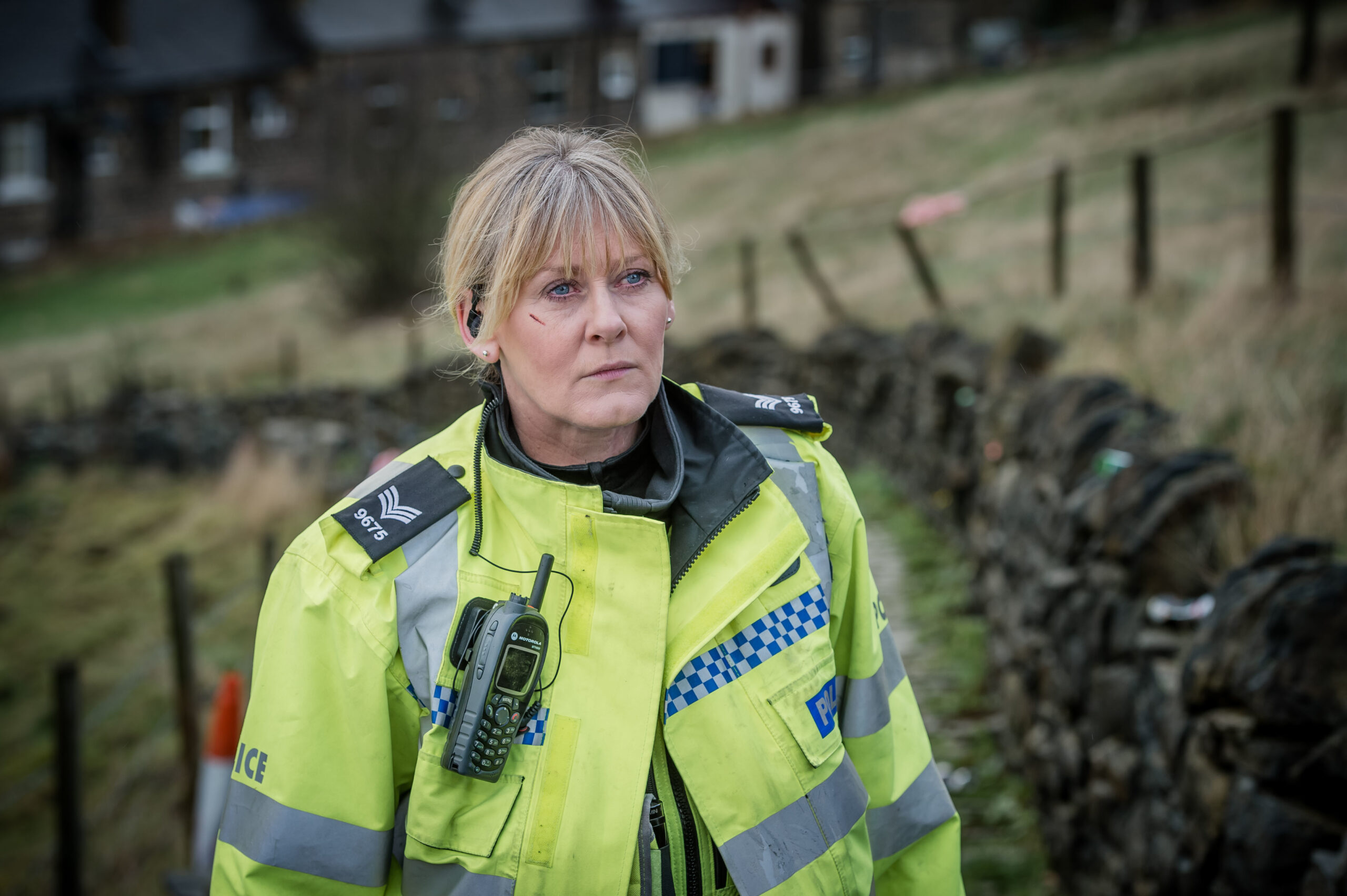 Catherine looks up in her uniform in Happy Valley