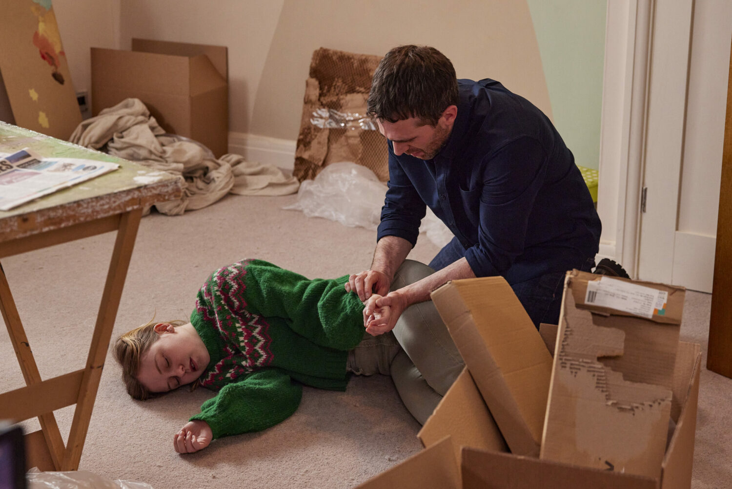 Coronation Street's Summer is lying unconscious on the floor whilst being tended to by Mike