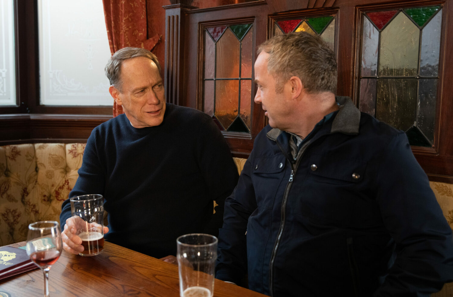 Coronation Streets Stephen and Teddy are having a drink in The Rovers