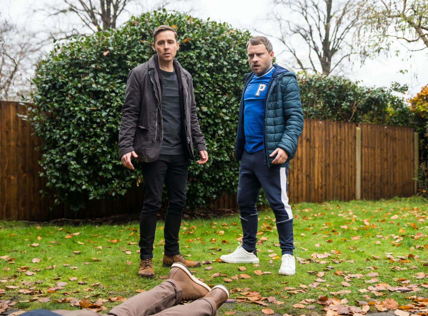 Todd and Paul look shocked as Mike lies lifeless in Coronation Street