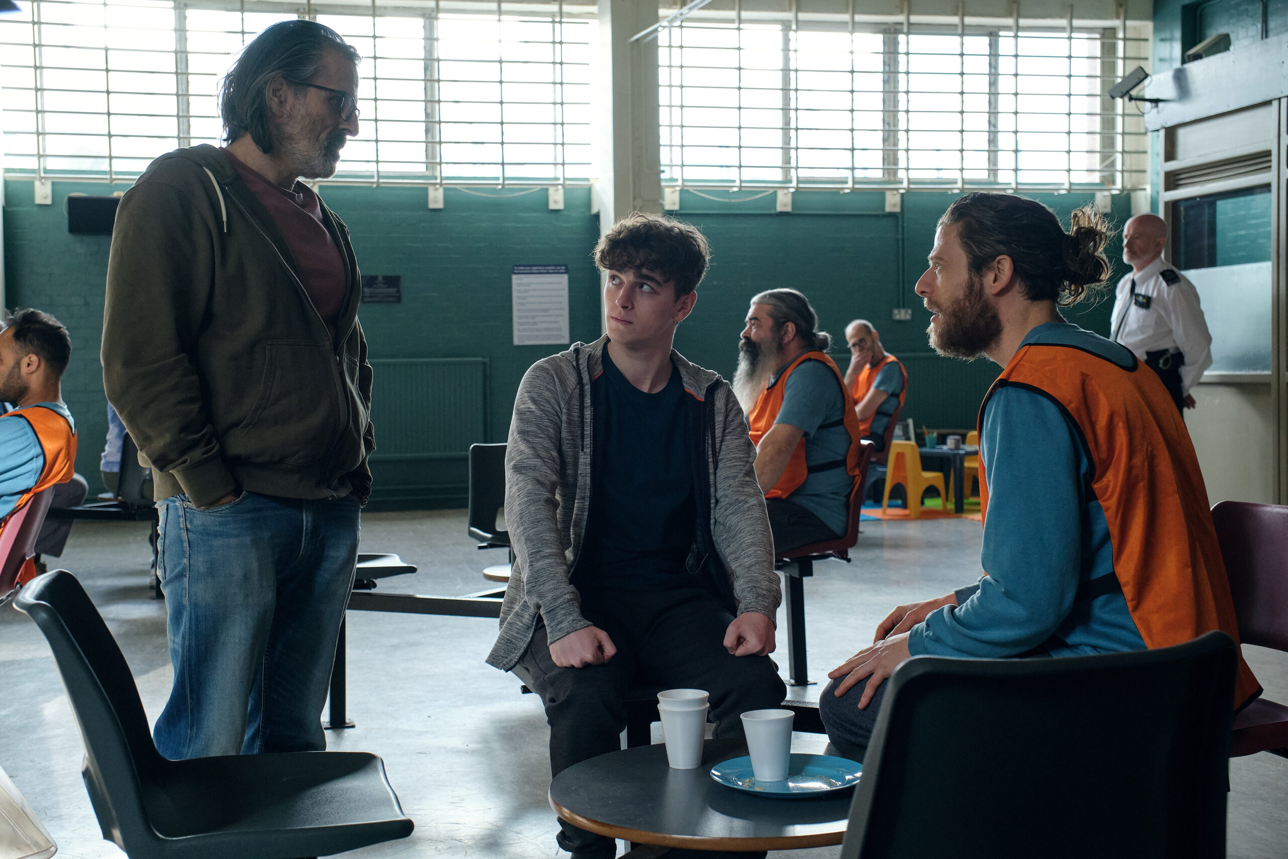 Neil, Ryan and Tommy speak together in prison in Happy Valley