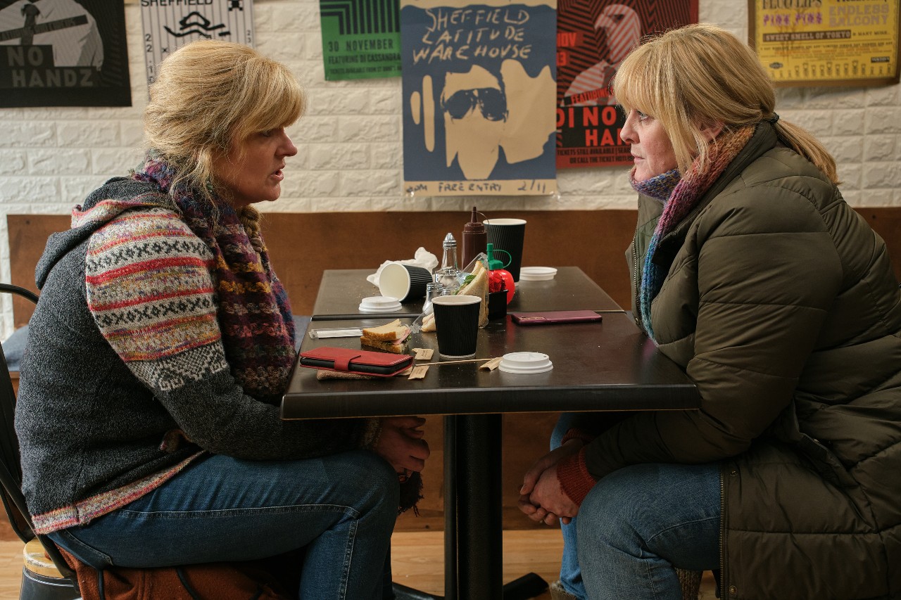 Catherine speaks with Clare in a cafe in Happy Valley