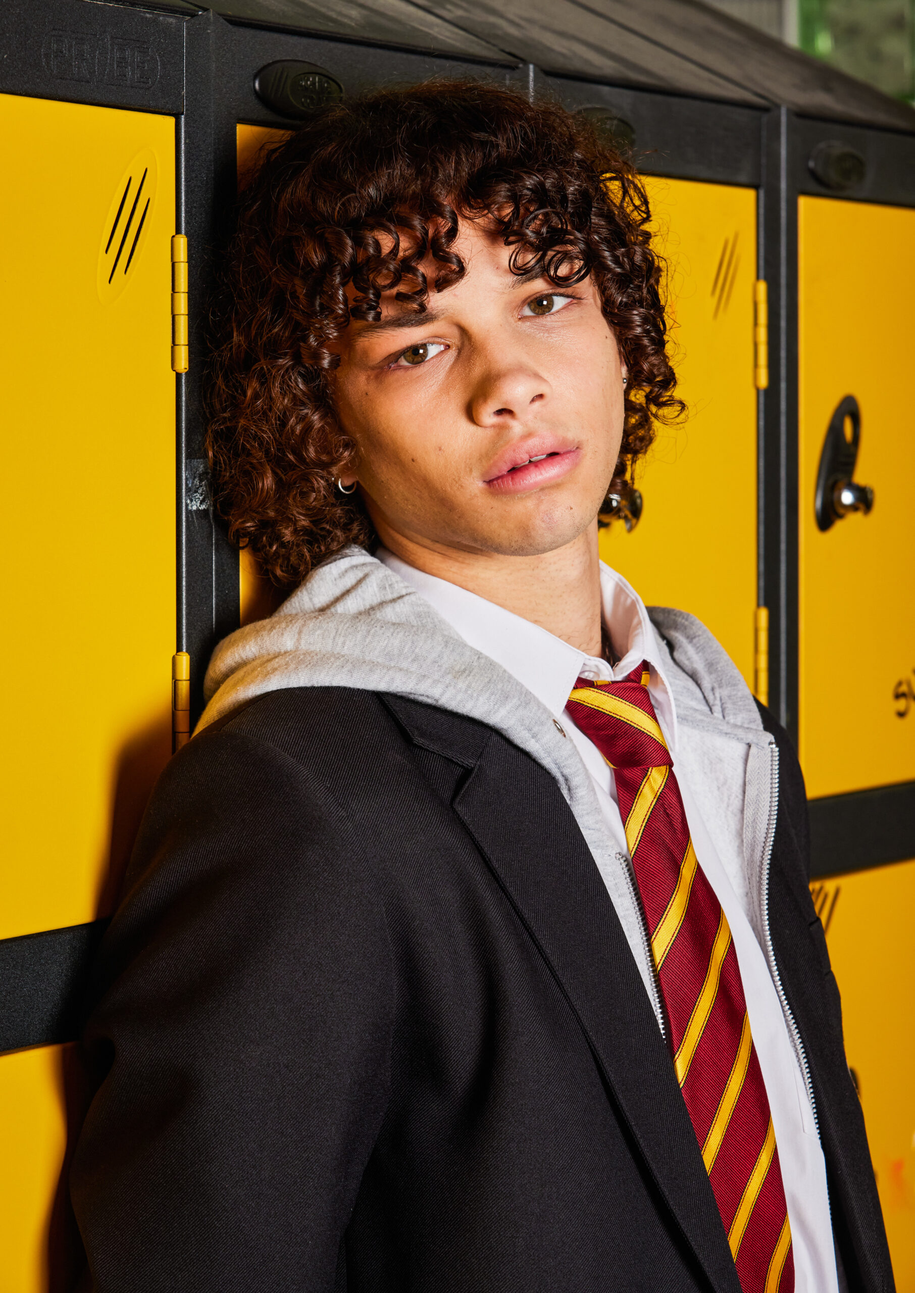 Danny Lewis leans on a locker in Waterloo Road