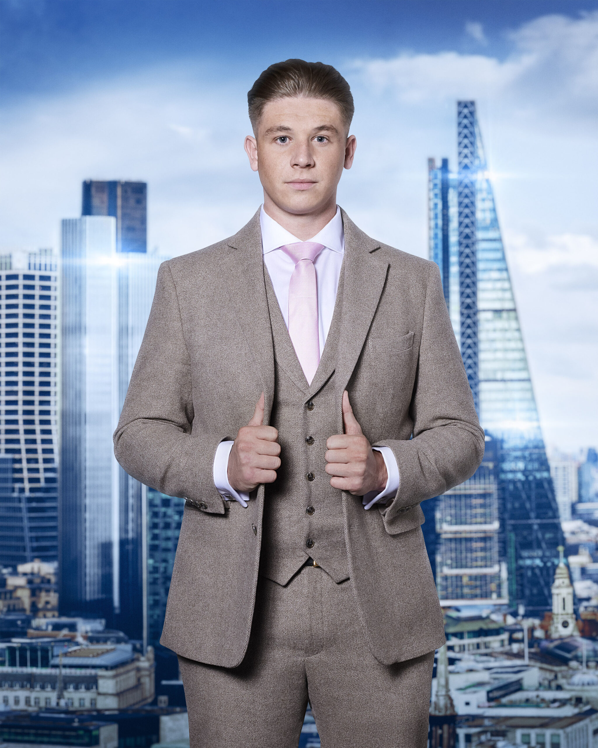 Bradley Johnson poses with his suit on The Apprentice