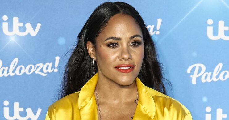 Alex Scott posing in yellow outfit at ITV Palooza