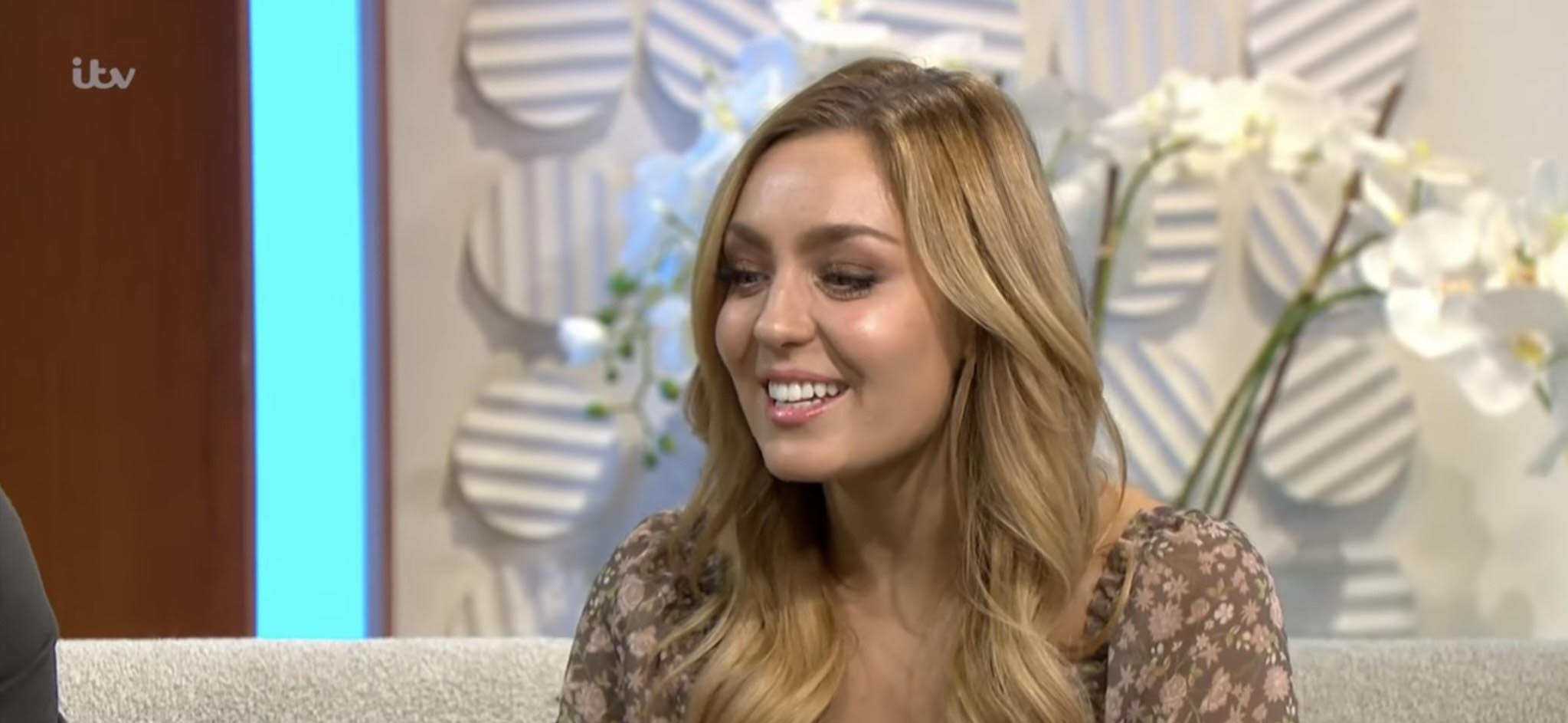 Strictly star Amy Dowden smiles and looks down on Lorraine