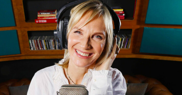 Jo Whiley standing behind a microphone talking about holidays