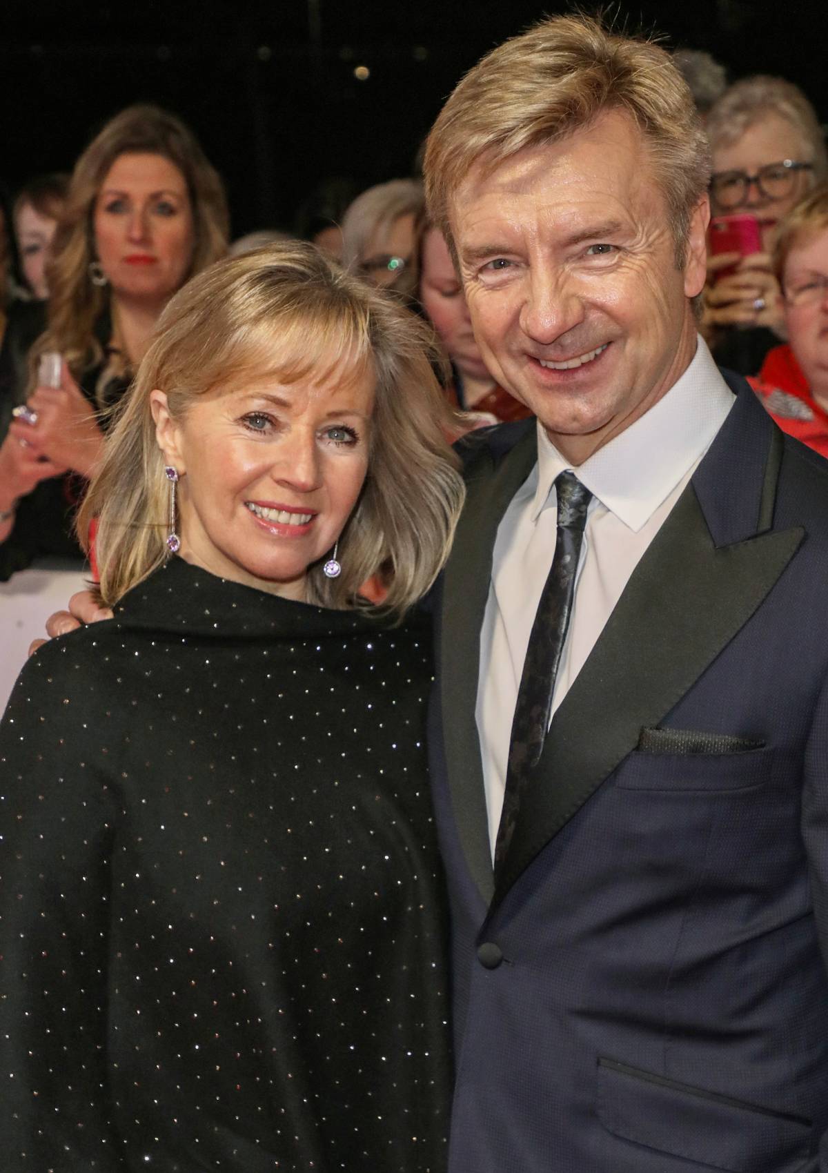 Karen Barber stands with Christopher Dean on the red carpet