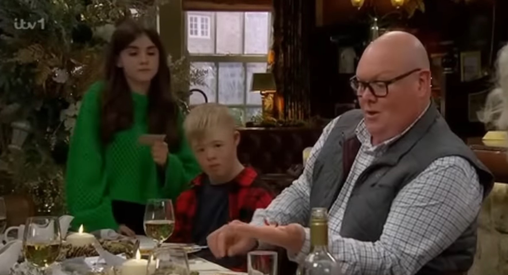 Emmerdale's April, Leo and Paddy at the Christmas dinner table