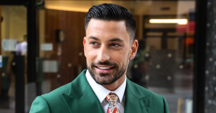 Giovanni Pernice smiling in a gran jacket