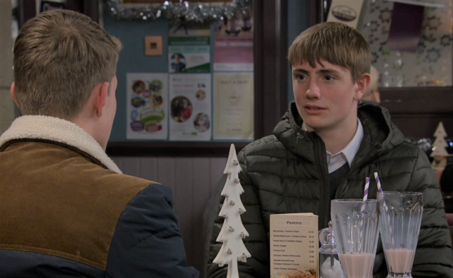 Marshall looking at Arthur in the cafe in Emmerdale 