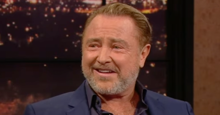 Michael Flatley smiling on TV