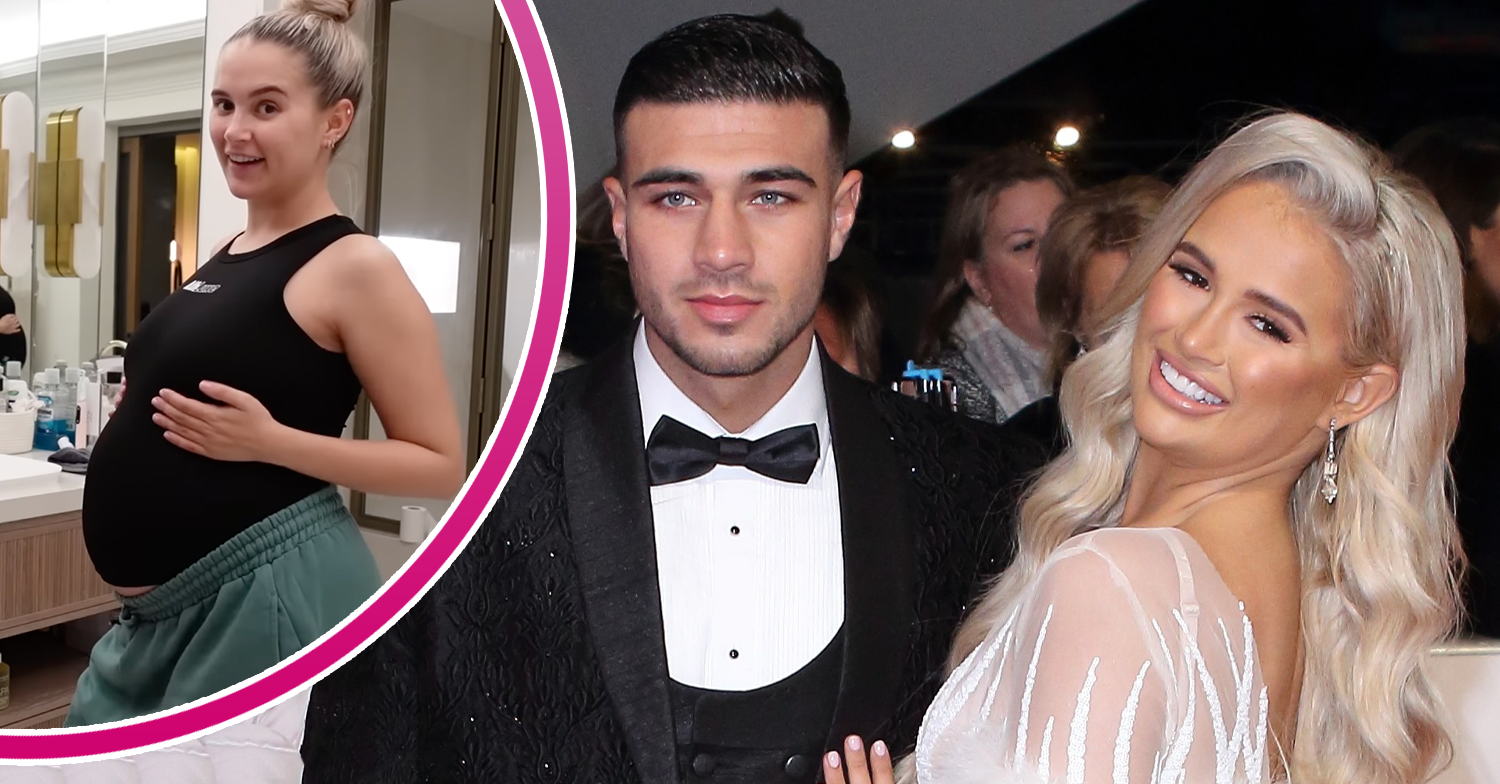 Molly-Mae Hague and Tommy Fury posing and showing her bump