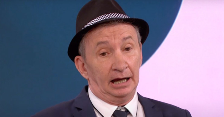 Only Fools and Horses star Patrick Murray being interviewed in a hat