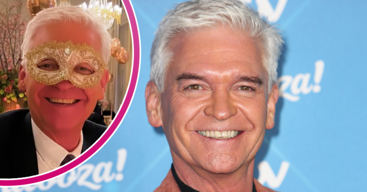 Phillip Schofield smiling and wearing mask on a night out