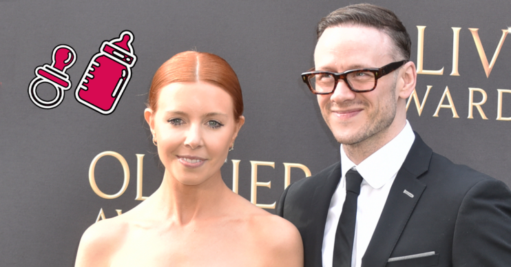 Stacey Dooley and Kevin Clifton smiling on the red carpet