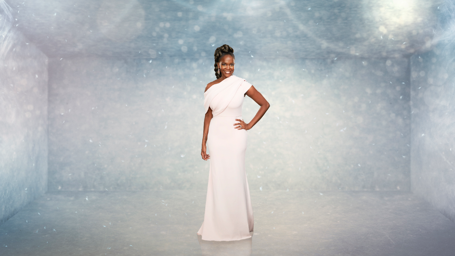 Oti Mabuse posing in a white dress on Dancing On Ice 2023