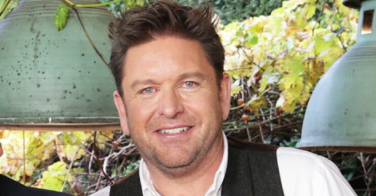 James Martin smiling in his kitchen