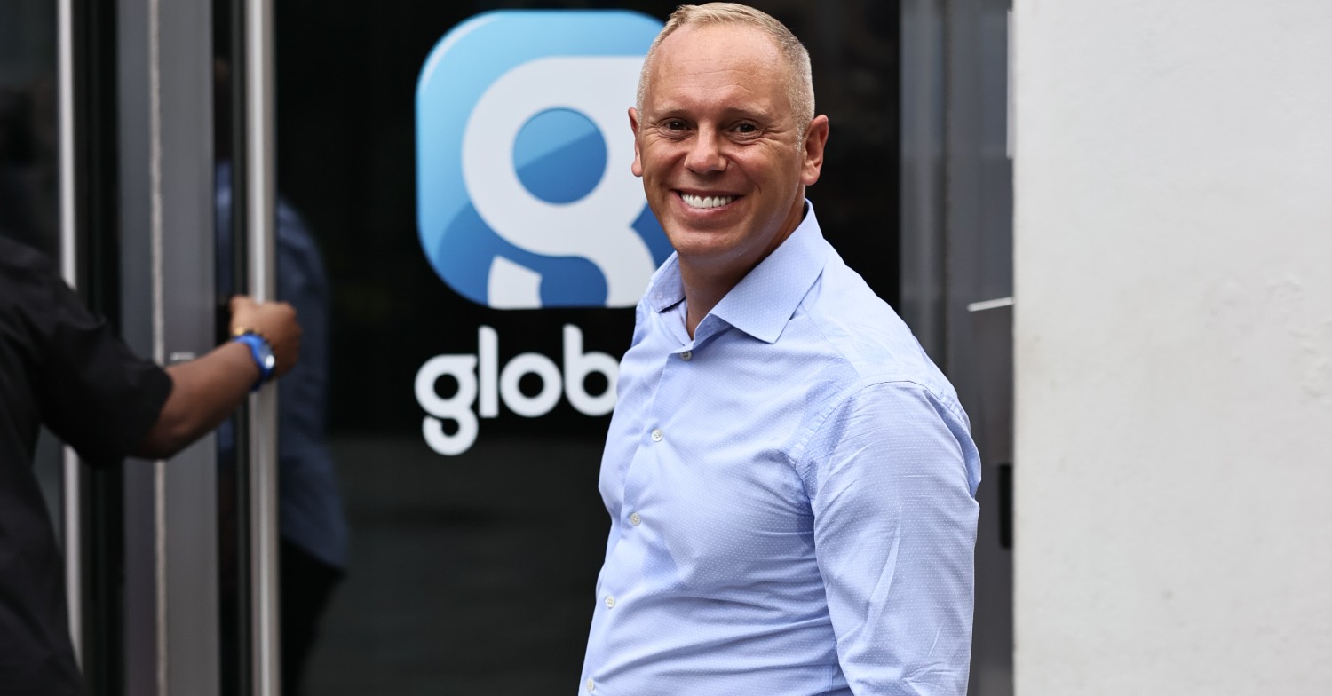 Judge Robert Rinder smiling in the street