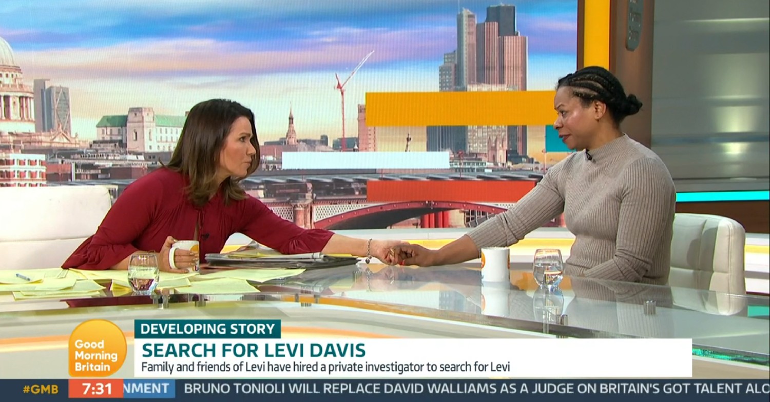 Susanna Reid holding Julie Davies' hand on GMB today 