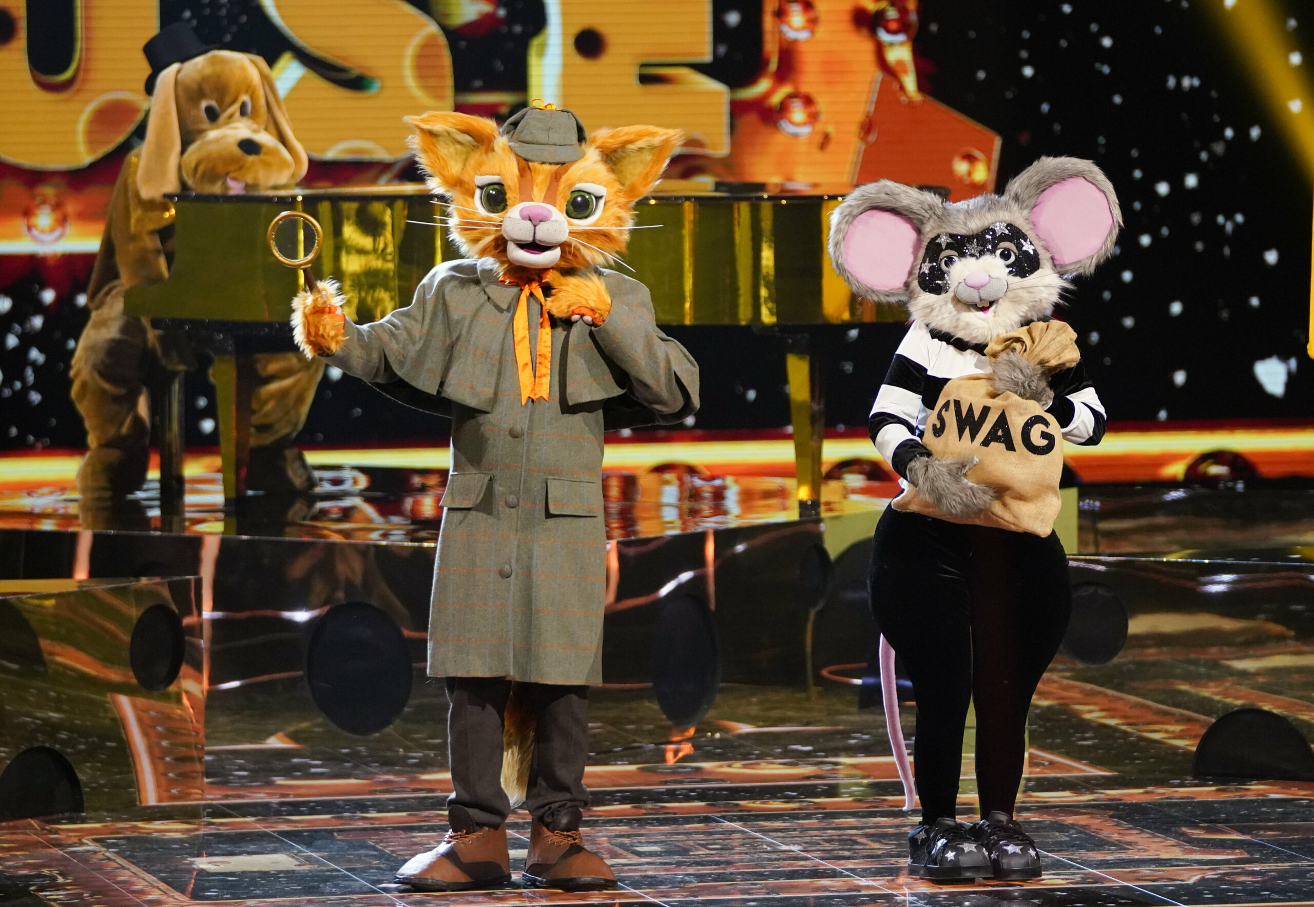 Cat & Mouse pose in their performance